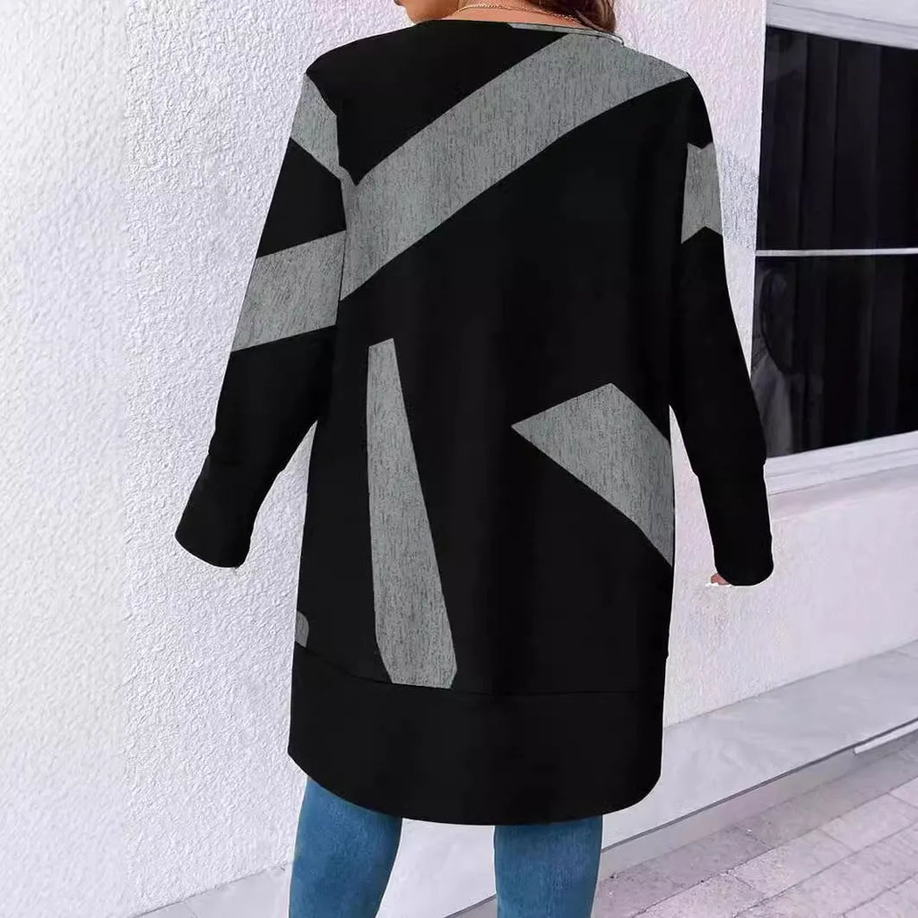 Black loose fit plus size knit cardigan with button detail on a hanger.