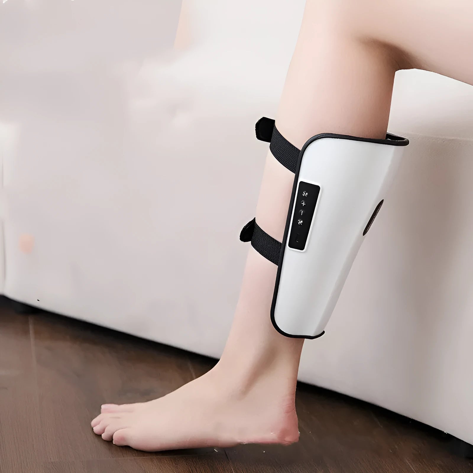 White plastic pulse calf massager with infrared heat, electrotherapy and 15 massage modes, showing Type-C USB port.