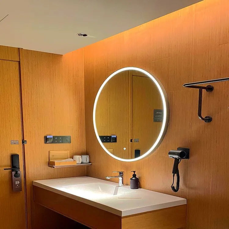 Round black aluminum alloy framed LED bathroom makeup mirror mounted on wall with touch control.