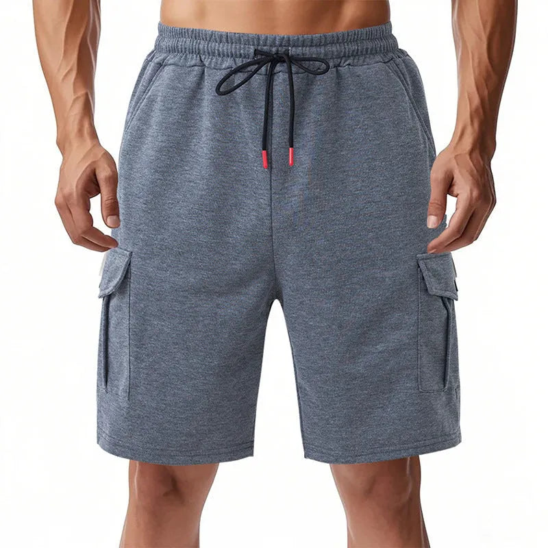 Men's light grey loose-fit terry cotton cargo shorts with multiple pockets on a plain background.