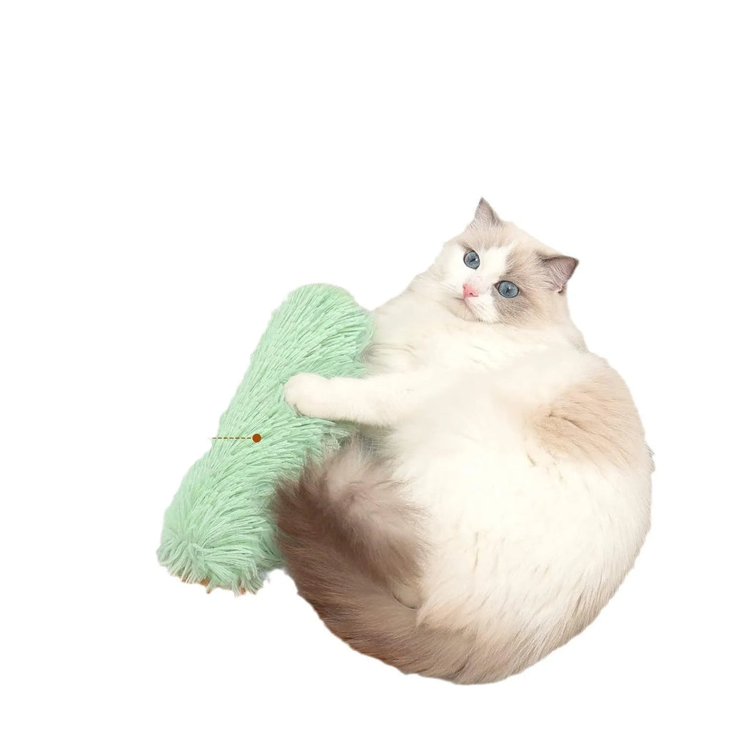 Plush cat toy pillow with squeaker in blue, green, pink, or white colours measuring 27cm by 10cm