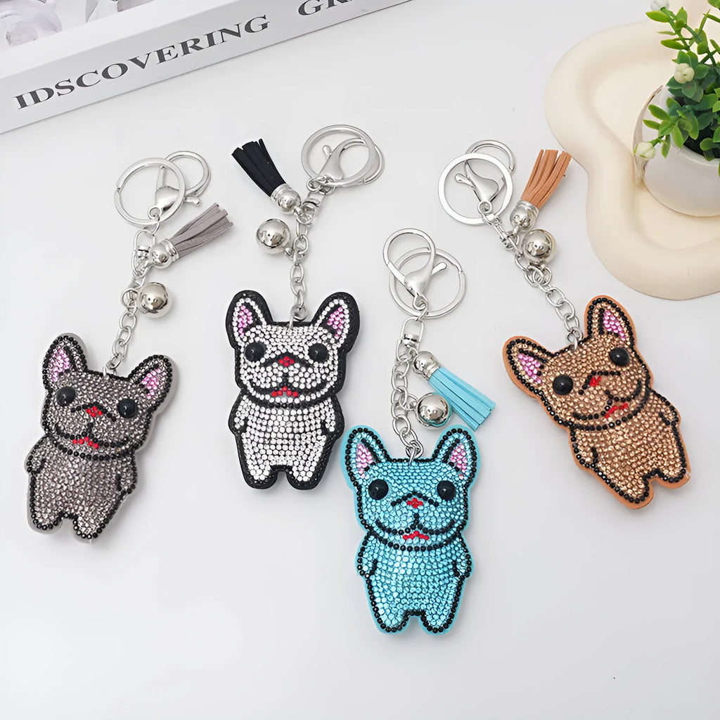 Close-up of a sparkling rhinestone French dog animal keychain charm in caramel colour.