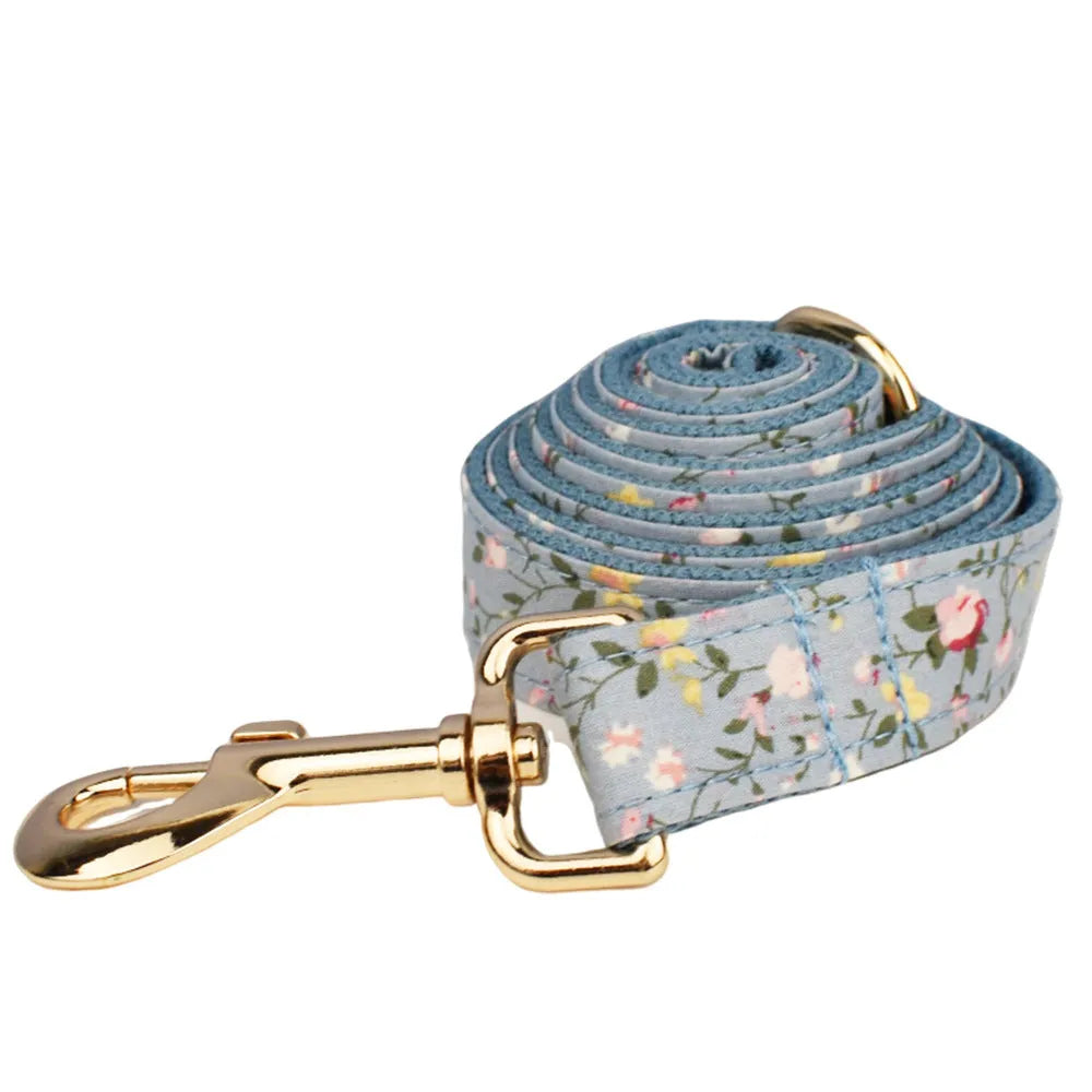 Floral pattern dog collar set with leash, vest, bow tie, and poop bag accessories in multiple sizes