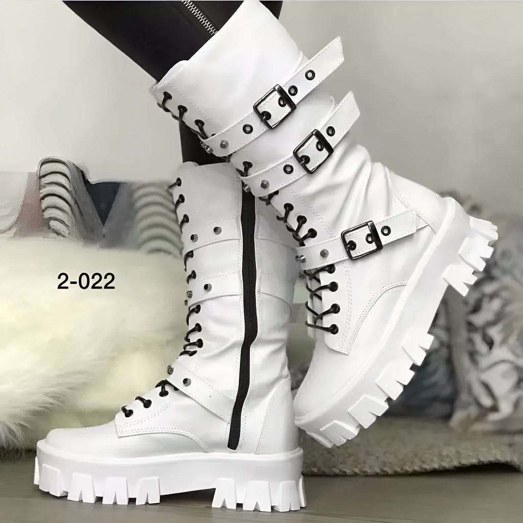 Women's black mid-calf buckle boots with side zipper and round toe on wooden floor