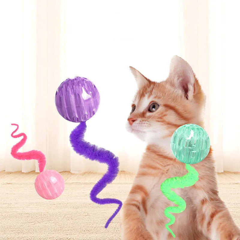 Interactive cat ball toy with worm tail in green on light background