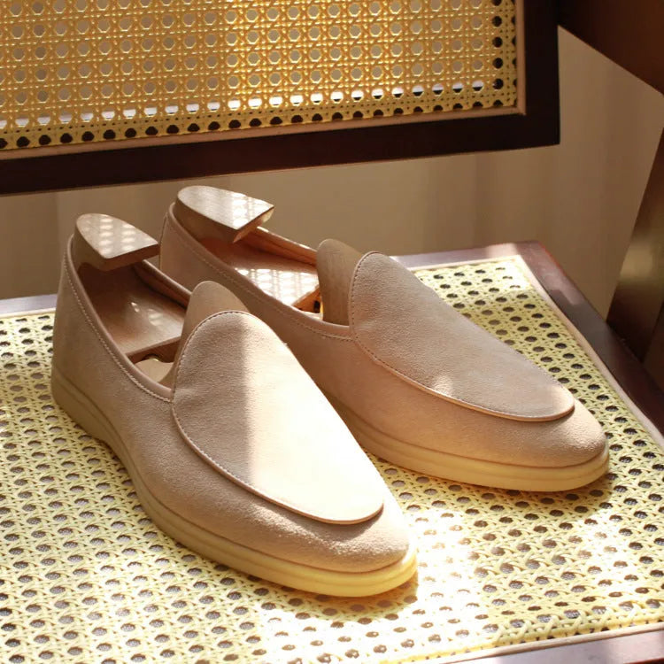 Men's handmade leather loafers in brown with TPR sole on wooden surface