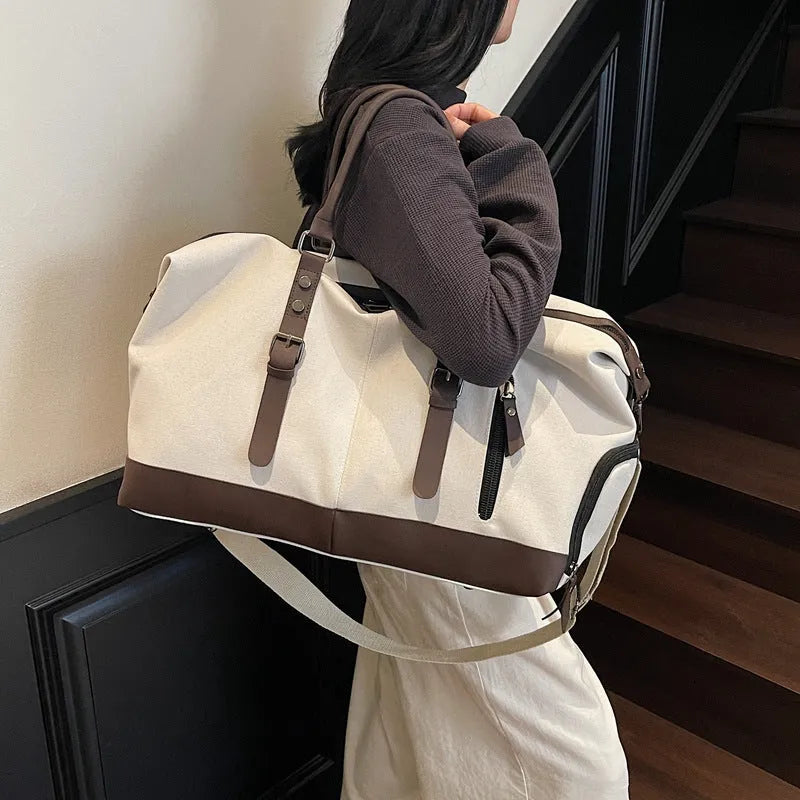 Canvas travel shoulder bag for men and women in solid black colour, breathable fabric, compact unisex design