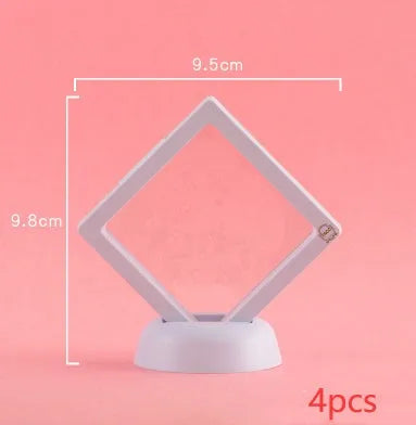 Transparent 3D floating display case holding a coin, with black and white size options