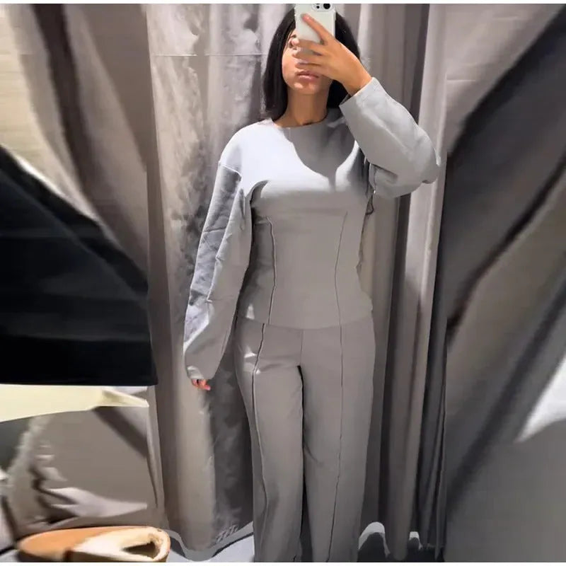 Women's polar fleece two-piece suit set showing O-neck top and wide leg trousers