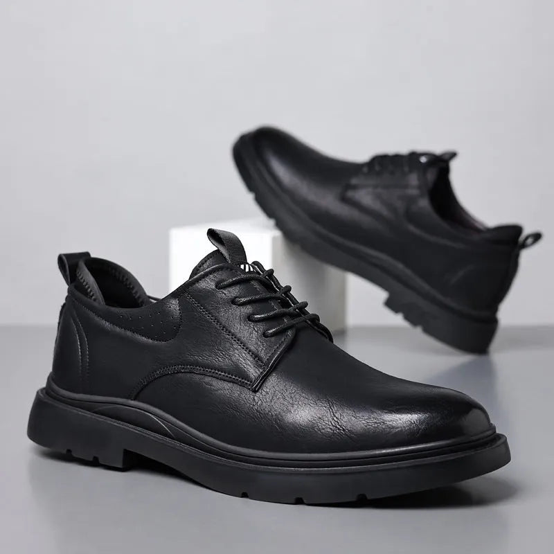 Men's black and brown leather casual sneakers with rubber sole and sewing line detailing