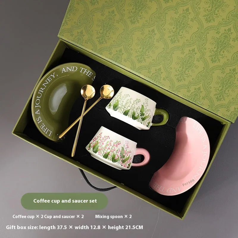 Ceramic coffee cup and saucer set with spoons in hanging bell or Lanling grass couple's cups design.