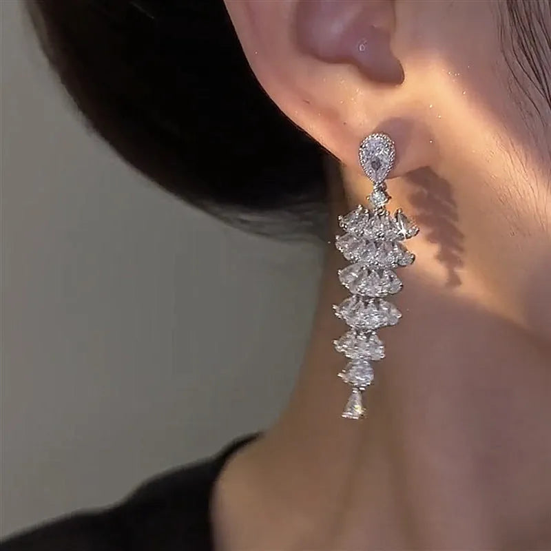 Silver pagoda-shaped Christmas tree drop earrings with sparkling zircon stones