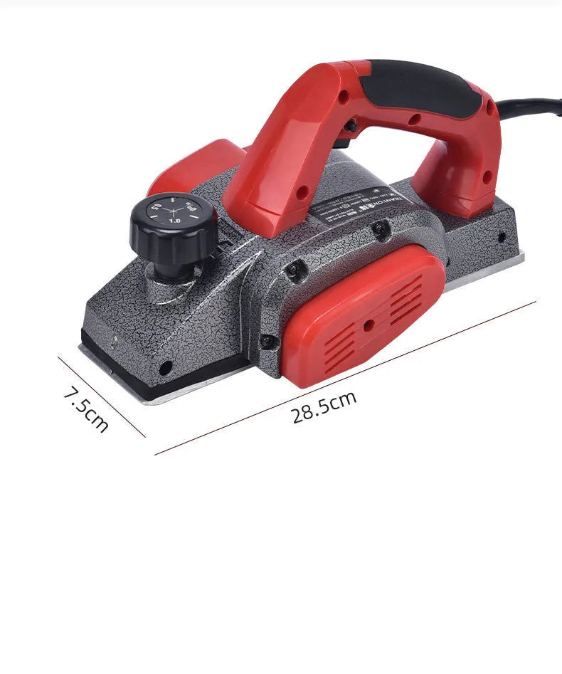 Red aluminium-shell electric wood planer with 82mm planing width on workbench