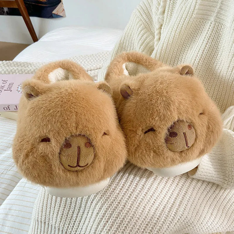 Light brown women's winter slippers with a cartoon pattern, plush upper, and wool lining.