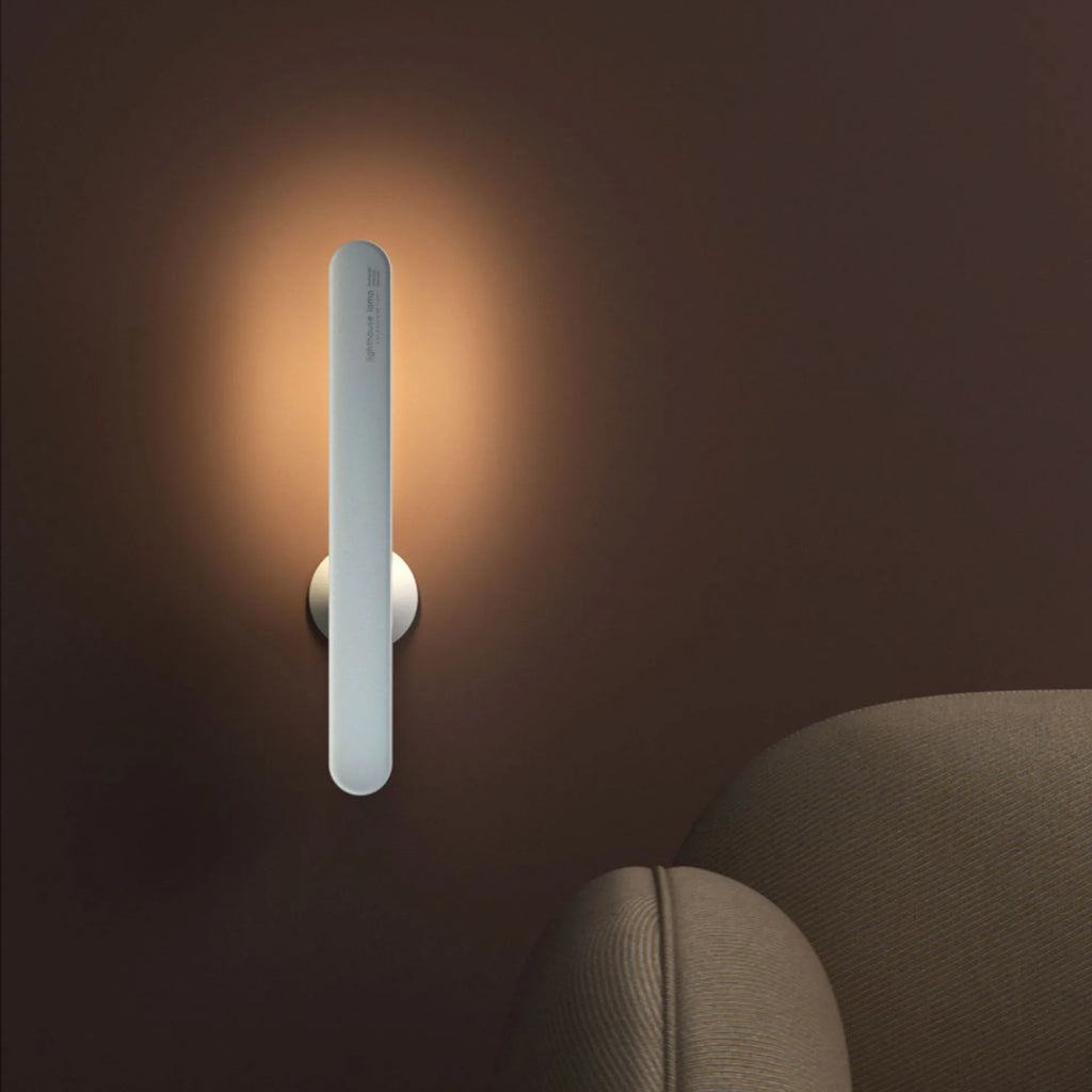 Geometric desk lamp with magnetic base shown in khaki colour with touch control