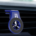 Black magnetic car phone holder attached to car air vent with phone mounted and adjustable rotation