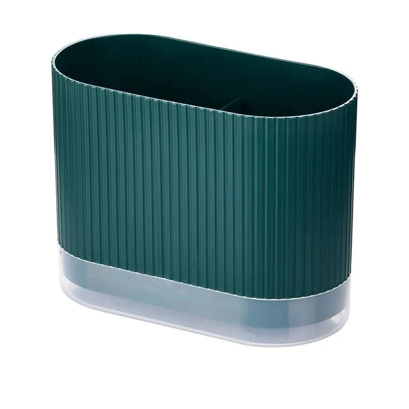 Plastic wall-mounted chopstick holder in beige with drainage holes, containing chopsticks and spoon