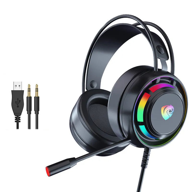 Black wired over-ear computer headphones with microphone and long cable on a desk