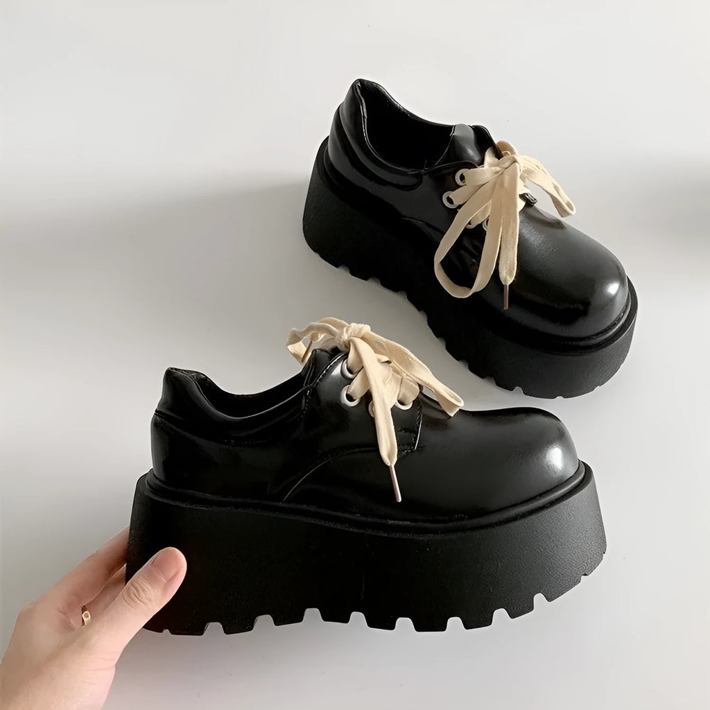 Matte black women's platform shoes with lace-up closure and 6-8cm block heel