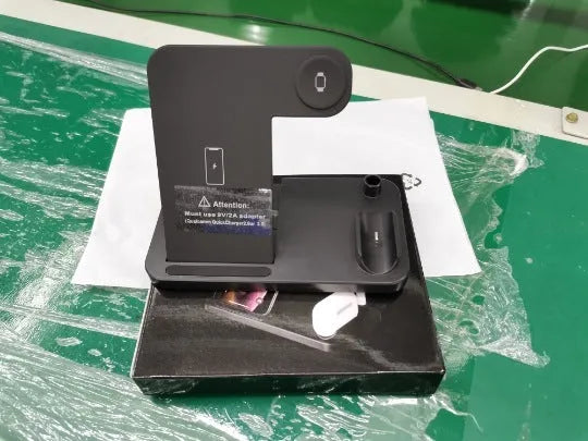 Folding 4-in-1 wireless charger in black showing vertical charging position for Apple iPhone