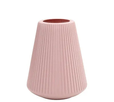 Colourful melamine plastic decorative flower vase measuring 16x20cm on desktop