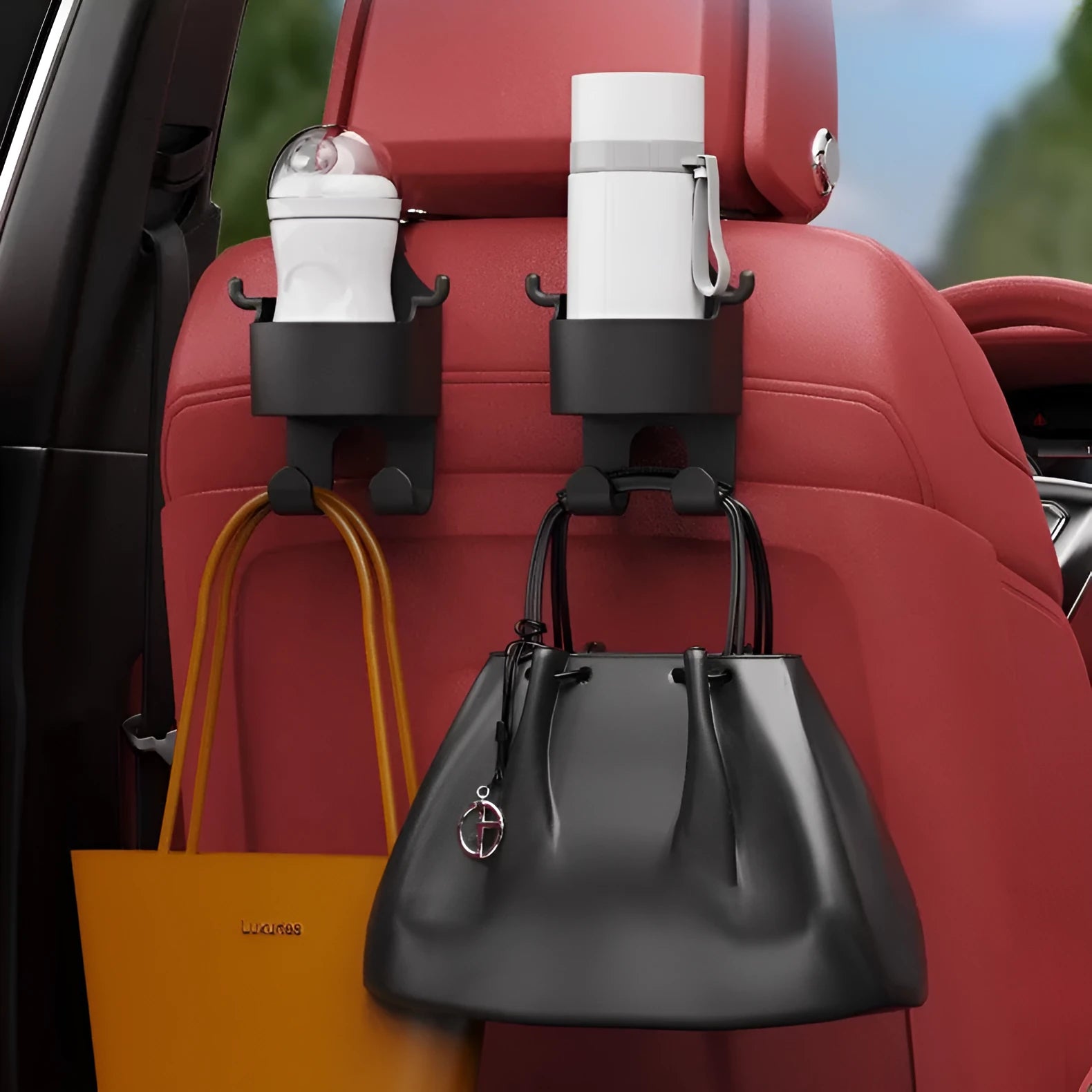 Black plastic car hook seat back organiser with cup holder and dual hooks mounted on headrest