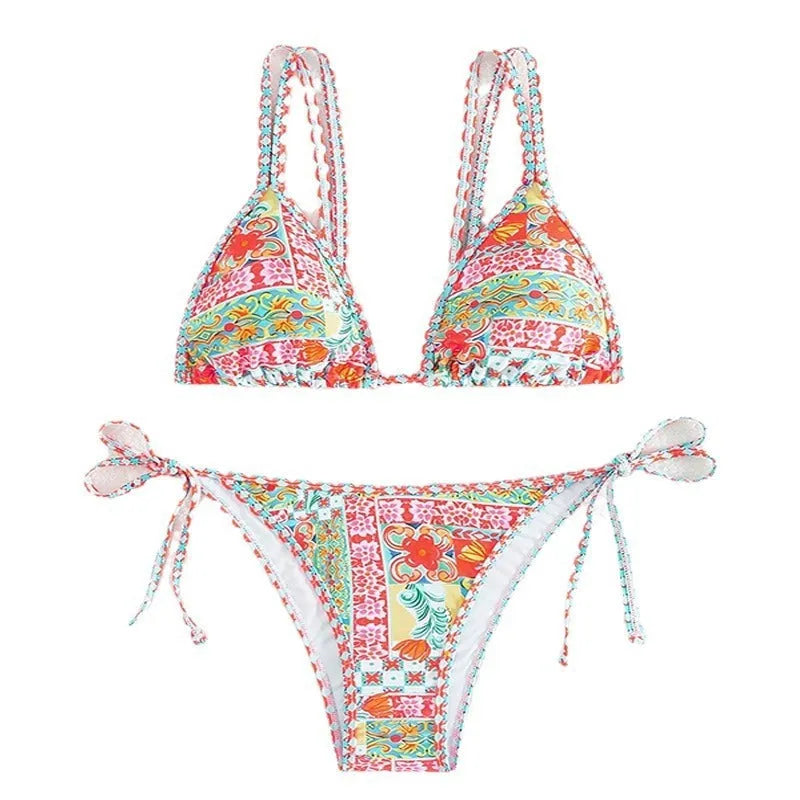 Women's lace-up split swimsuit in picture colour, showing backless brief design for swimming.