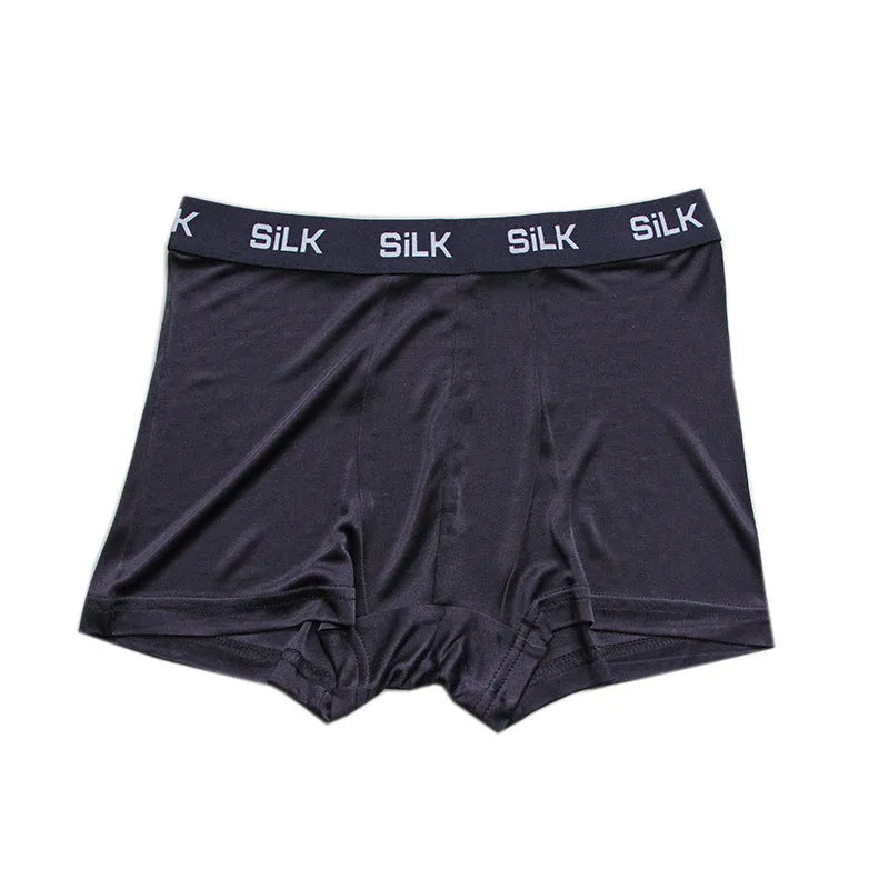 Men's silk shorts in loose fit design showing navy blue, silver grey, and skin colour options