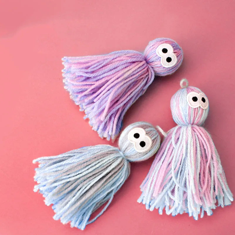 Wool ball cat toy with hanging loop in blue-grey colour combination