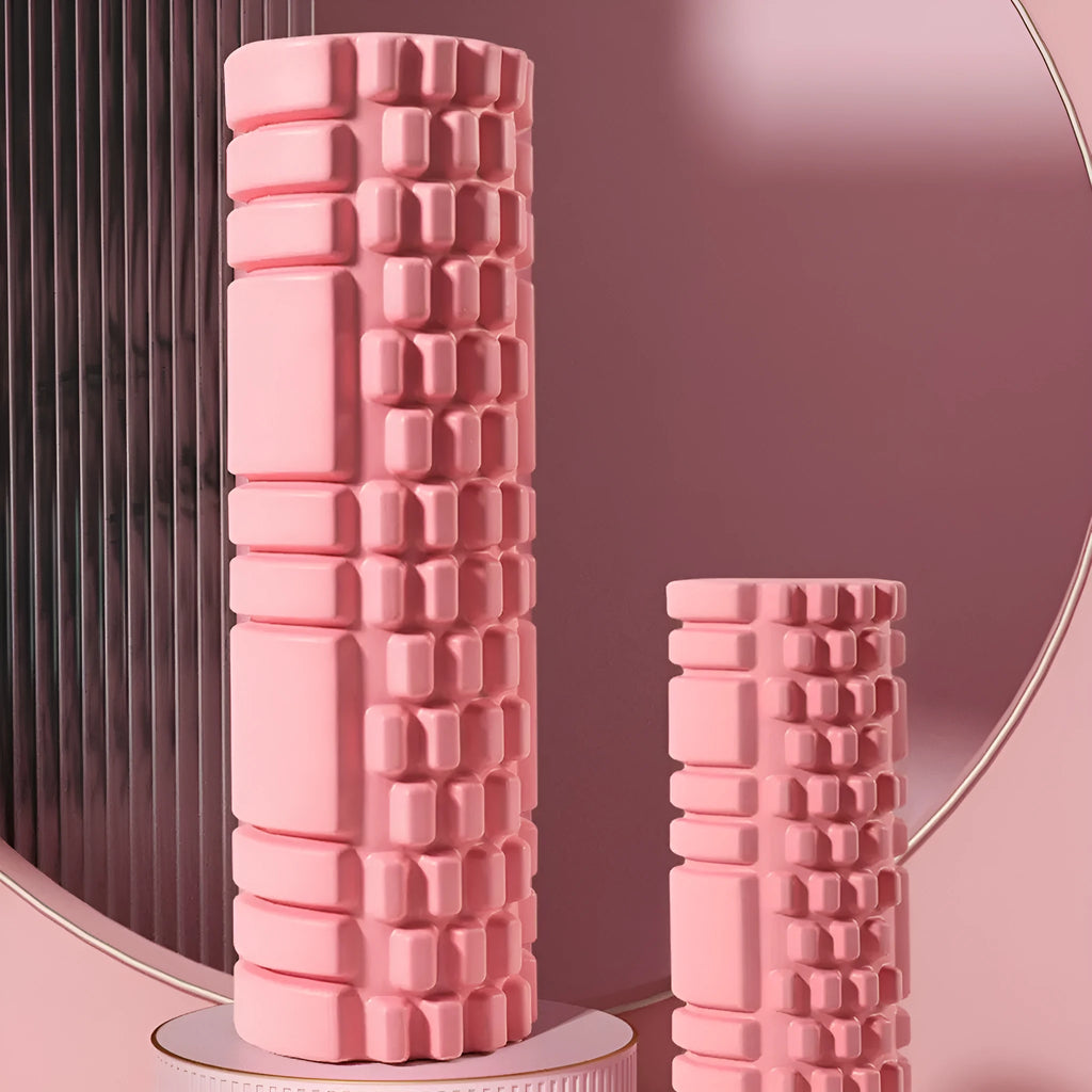 EVA foam roller in choice of colours including black, grey, pink, sky blue, and light purple on a gym floor.
