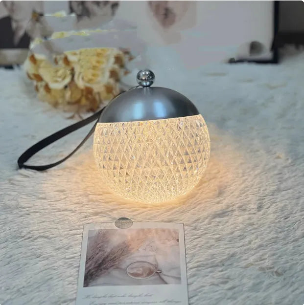 Portable dimmable LED desk lamp in chrome finish with touch control, 12cm diameter