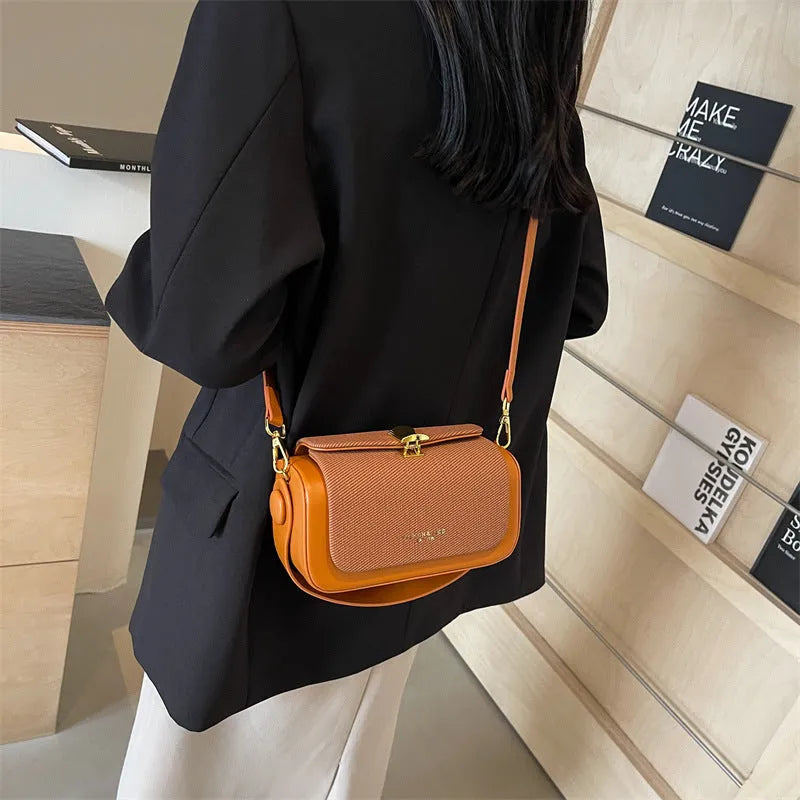 Women's PU messenger bag with lock and contrast stitching in rose pink colour, horizontal square shape