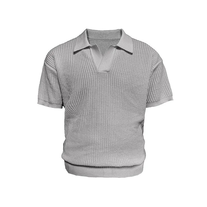 Man wearing a creamy-white loose-fit polo shirt with a striped collar, short sleeves, for summer business casual wear.