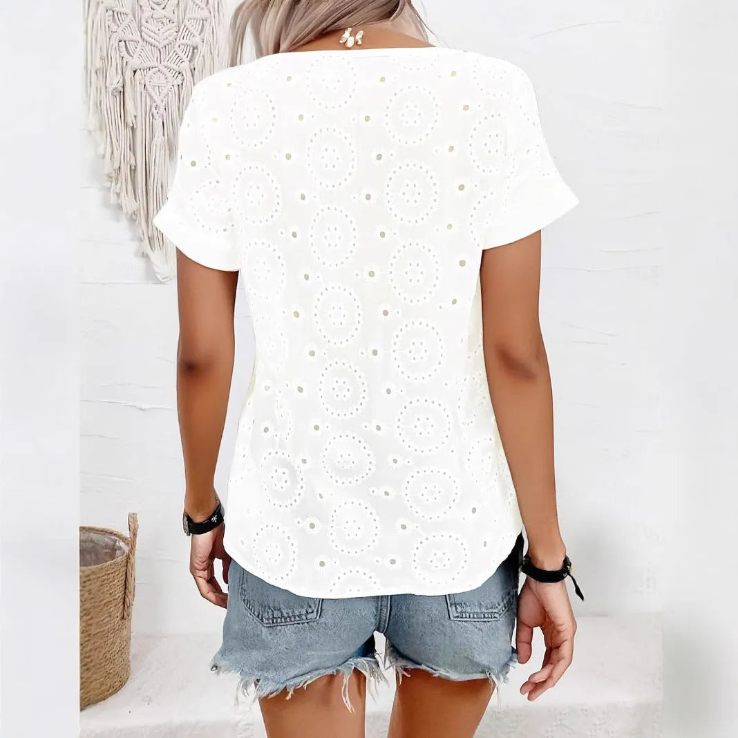 White women's V-neck t-shirt with hollow detailing and loose fit short sleeves