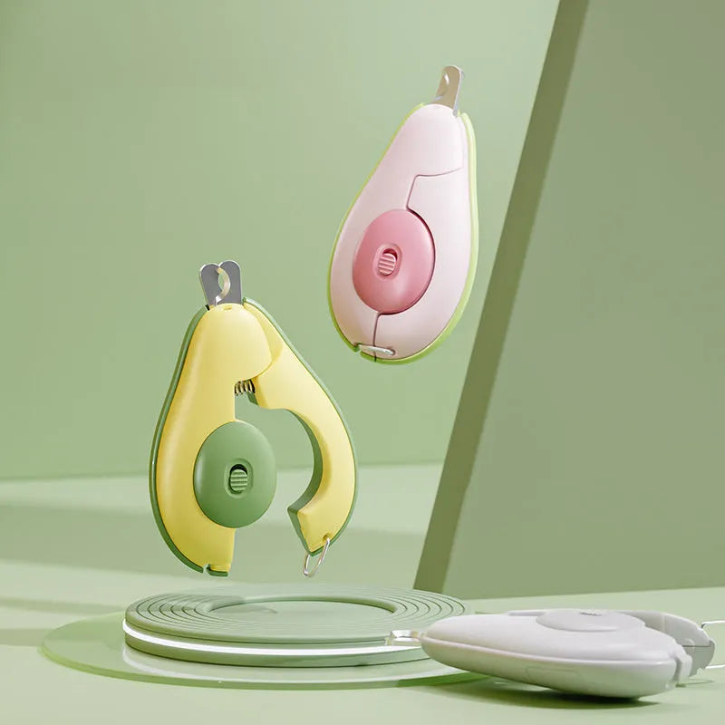 Green professional pet nail clipper with LED light on, showing safety guard and ergonomic handle.