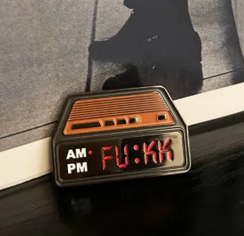 Creative Home black metal retro alarm clock brooch pin with original design on a jacket lapel