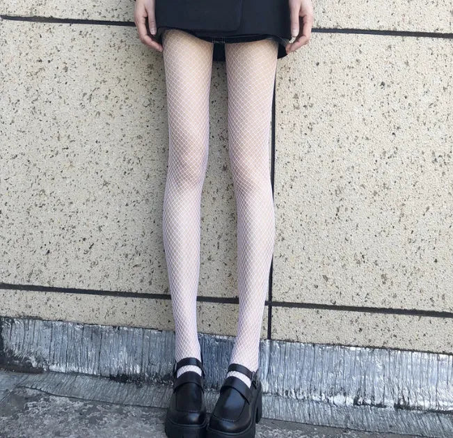 Women's mesh stockings showing large net, medium net and small net patterns in black and white colours