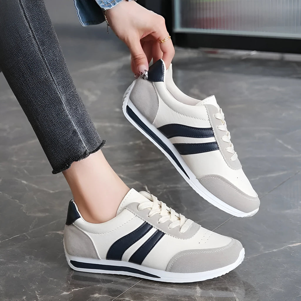 Red and blue lace-up low-top running sneakers with a PU mesh upper and flat rubber sole.