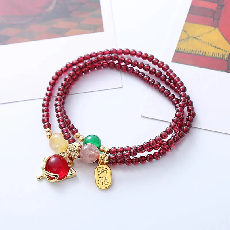 Natural crystal fox bracelet for women with purplish red garnet pendant on adjustable rope