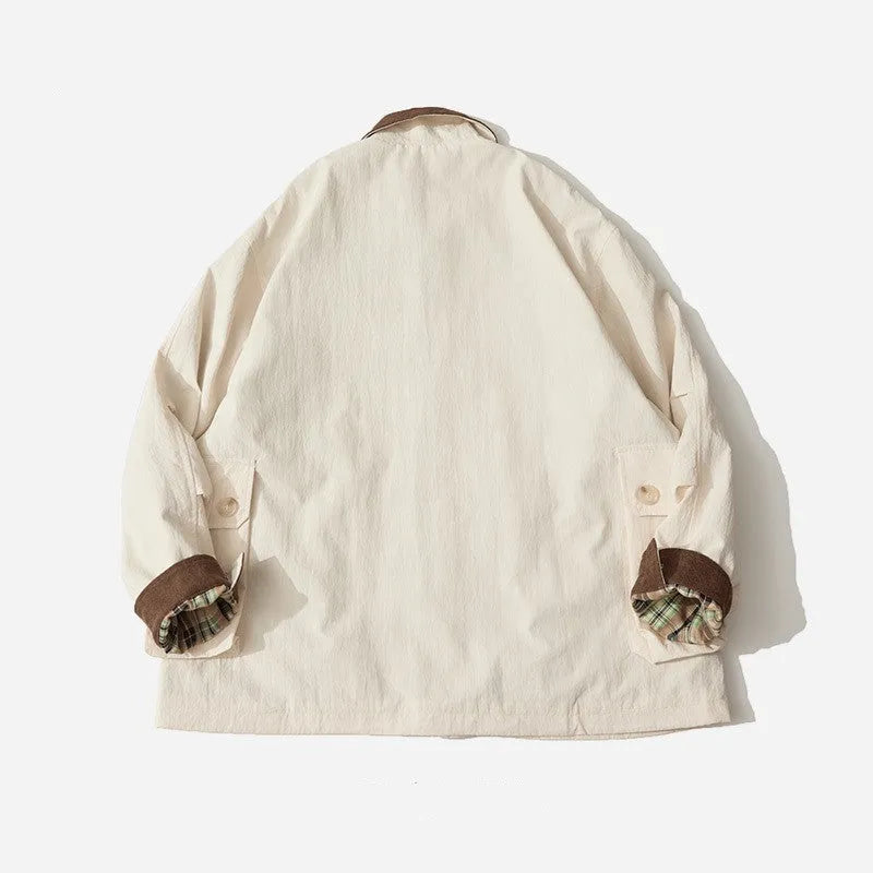Green solid colour casual jacket with long sleeves and side seam pockets on a hanger