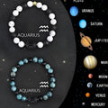 Set of twelve natural stone zodiac sign bracelets with elastic closures arranged in circle