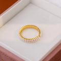 Gold geometric open mouth women's ring with round pearl design elements on copper base