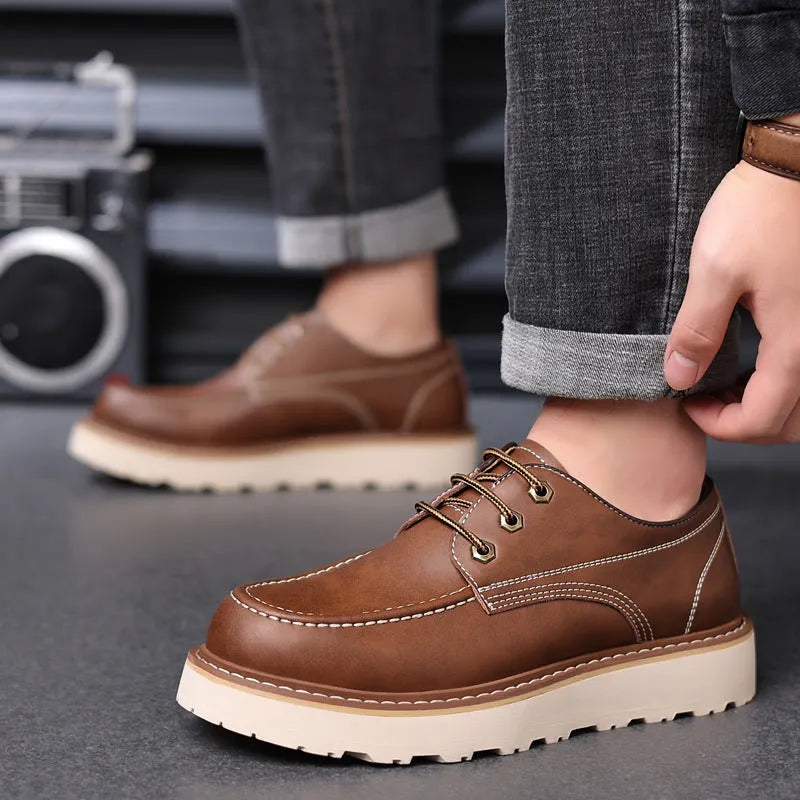 Men's black retro low-top casual boots with a round toe and rubber sole on a white background.