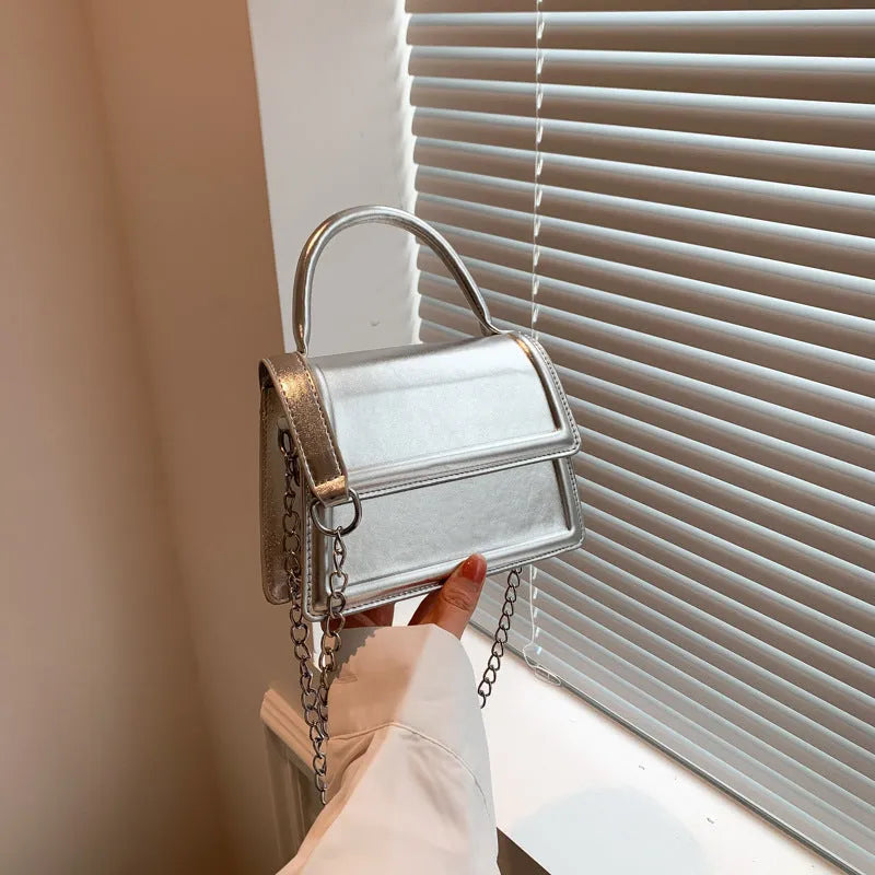 Retro square crossbody bag in PU material showing sewing line detail and crossbody strap