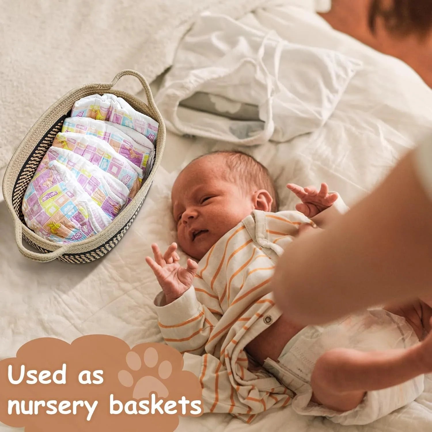 Light beige handmade cotton rope woven storage basket with handle on a wooden surface.