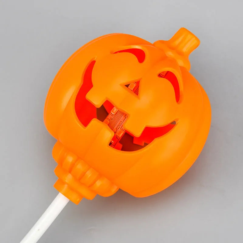 Plastic pumpkin-shaped decorative lamp with USB charging port, showing yellow or purple light option.