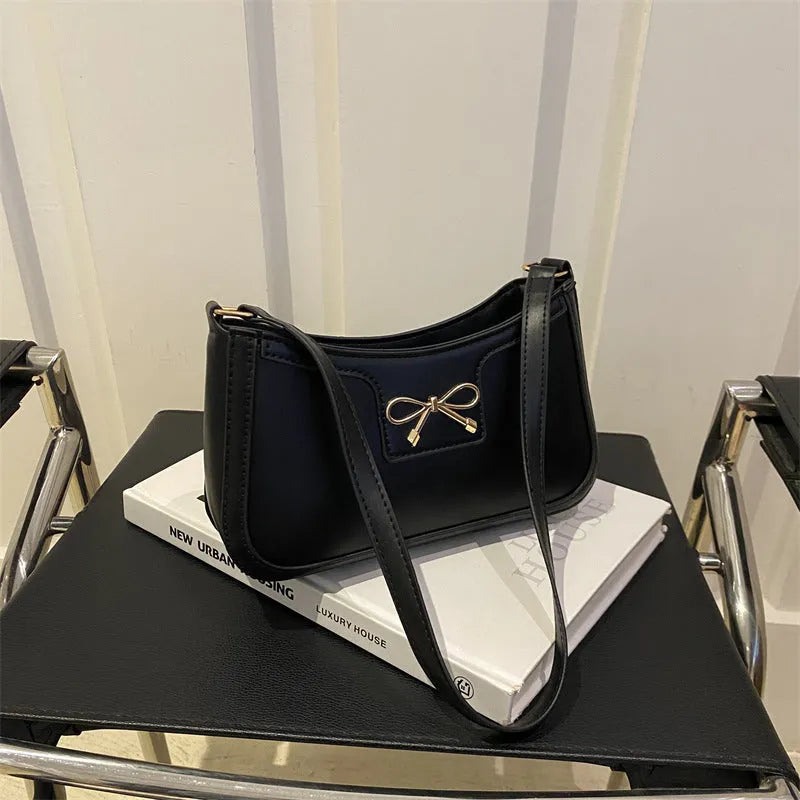 Portable shoulder western style bagg bag in PU with bow accent, available in six colours, 24x14x5 cm