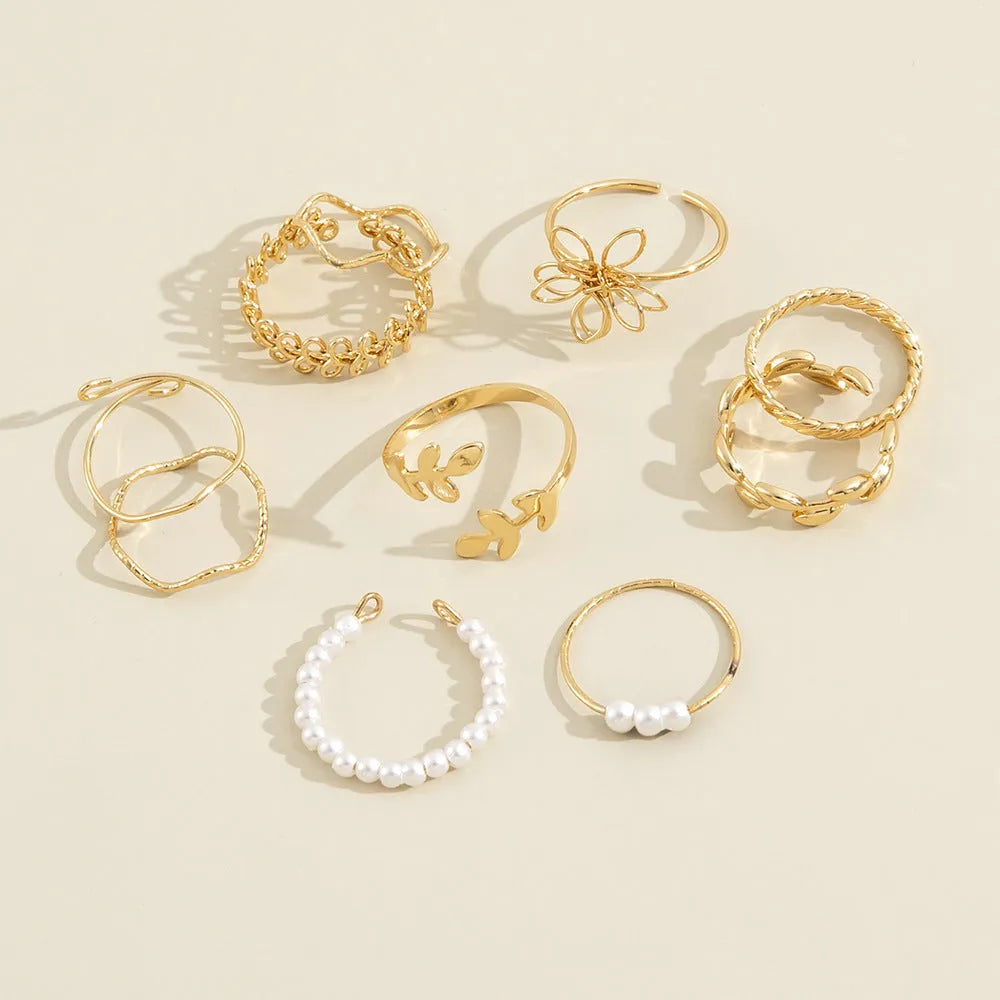 Women's gold alloy ring with openwork flower design and glossy electroplated finish