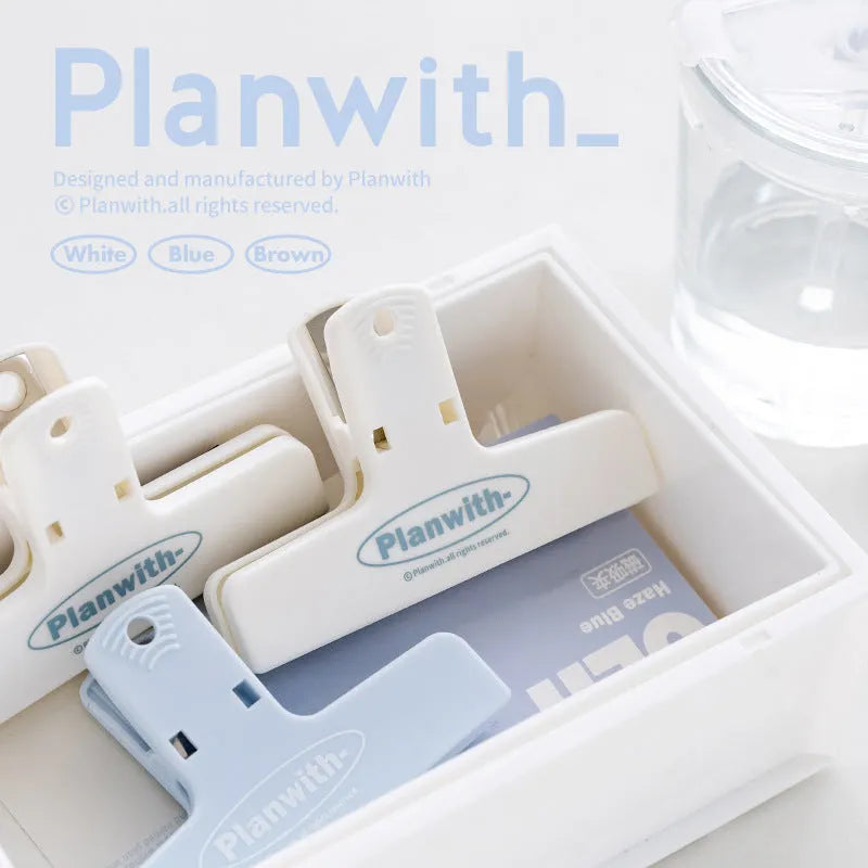 RosyPosy Haze Series magnetic bill clip in haze blue colour showing document holding function