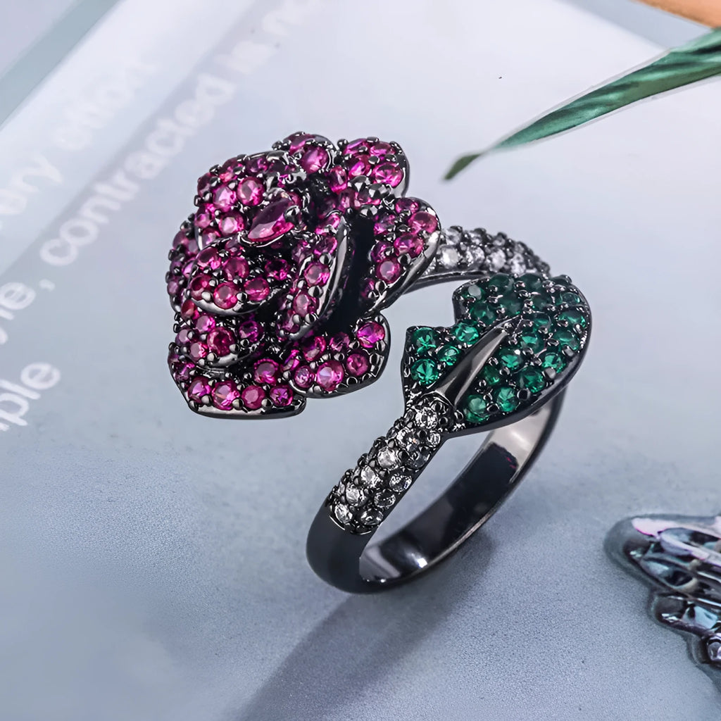 Geometric black gold women's ring with simulated red corundum stone and flower design elements